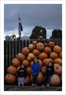 My Grandchildren with their giant Pumpkins.